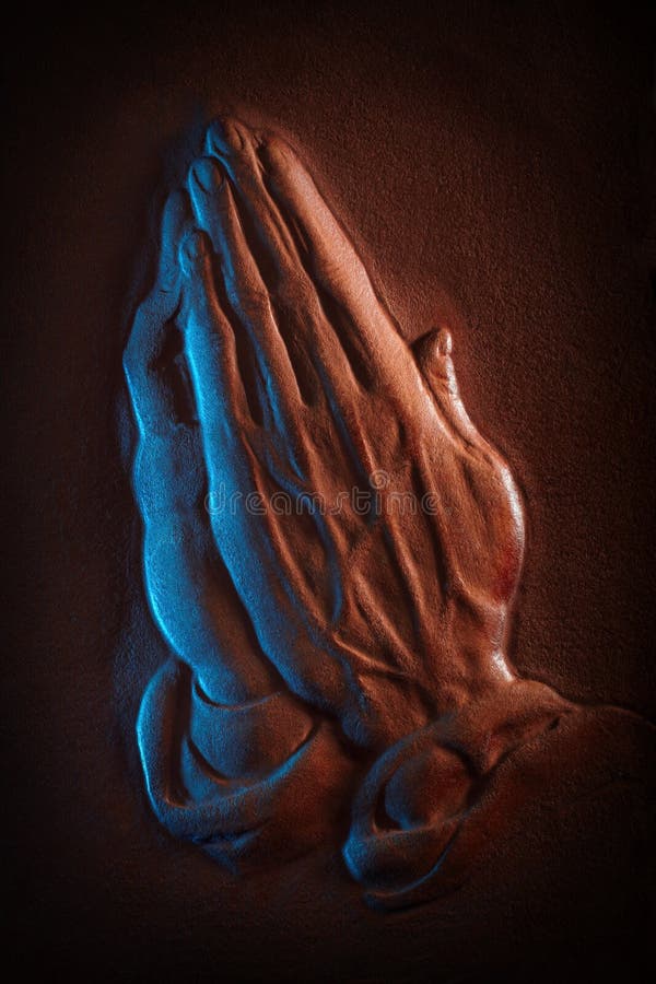 Leather sculpted in the shape of praying hands. Leather sculpted in the shape of praying hands