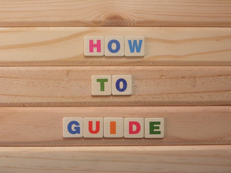 Word How to guide on wood background. Word How to guide on wood background.