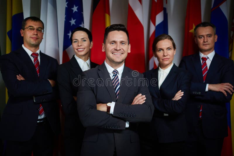 Portrait of national business team standing with arms crossed. Portrait of national business team standing with arms crossed