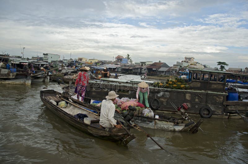 December 29, 2012 - Can Tho Province, Vietnam. Unidentified People on the boats in floating market. December 29, 2012 - Can Tho Province, Vietnam. Unidentified People on the boats in floating market.