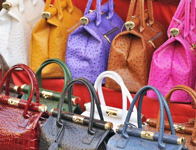 Brightly colored leather bags at an italian street market. Brightly colored leather bags at an italian street market
