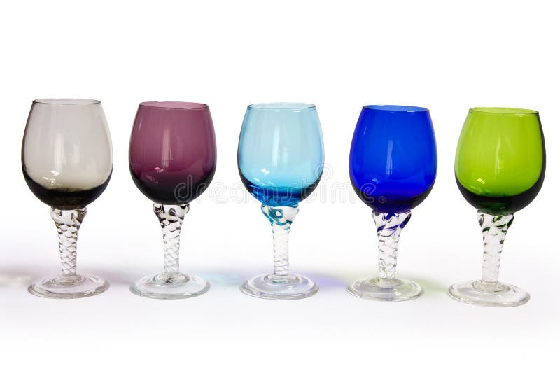 Five colored sherry glasses in a row on white background,clipping path. Five colored sherry glasses in a row on white background,clipping path