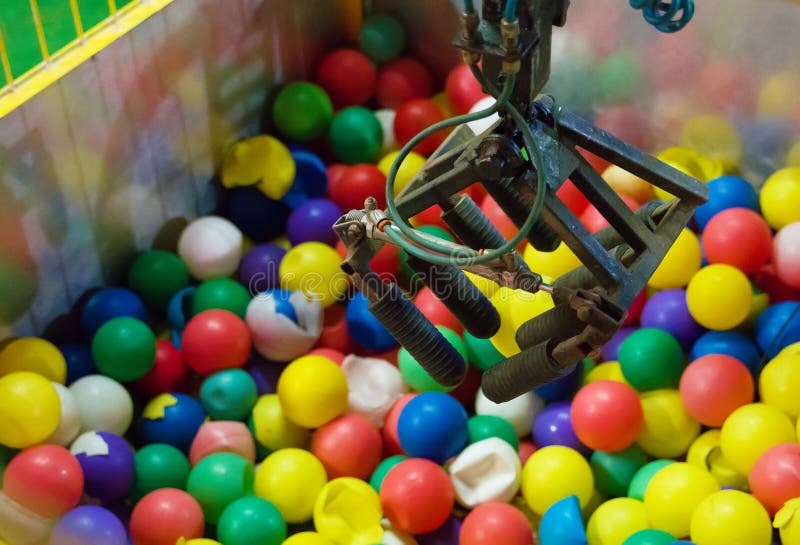 Coin operated claw game with balls. Coin operated claw game with balls