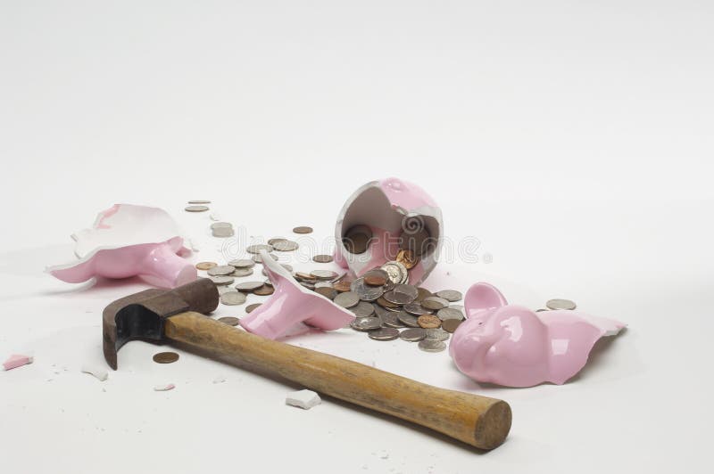 Broken piggybank with hammer and coins isolated over white background. Broken piggybank with hammer and coins isolated over white background