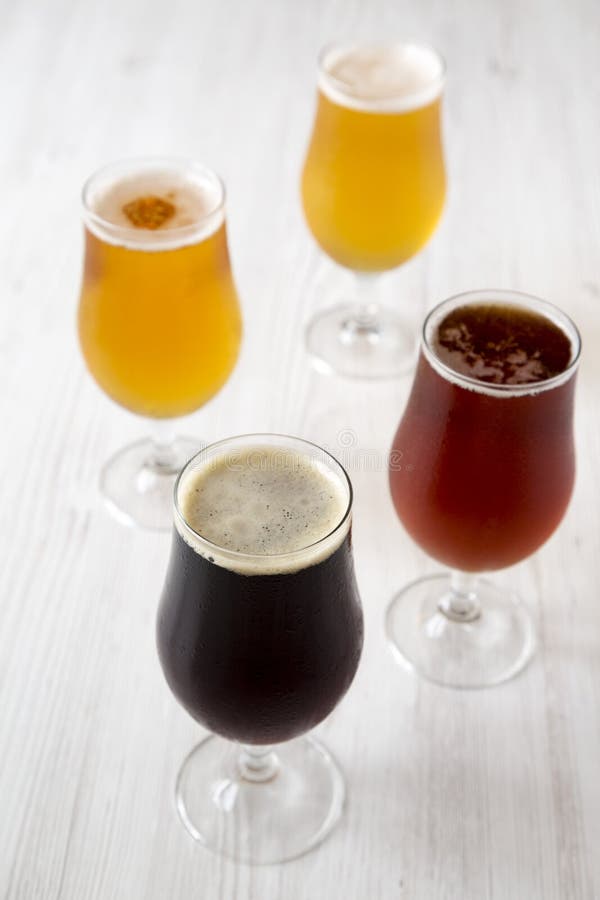 Сold craft beer assortment, side view. Close-up royalty free stock image Сold craft beer assortment, side view. Close-up royalty free stock image