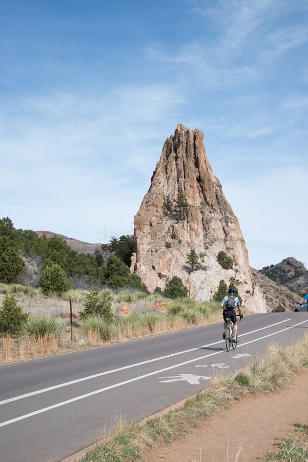 Bicycle cyclists in bike lane on road in the garden of the gods in colorado springs - travel photography on a colorado vacation in the rocky mountains. Bicycle cyclists in bike lane on road in the garden of the gods in colorado springs - travel photography on a colorado vacation in the rocky mountains.