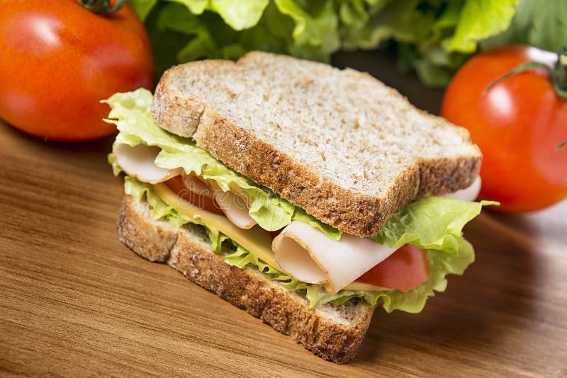 Chicken breast sandwich with salad, cheese and tomatoes. Chicken breast sandwich with salad, cheese and tomatoes