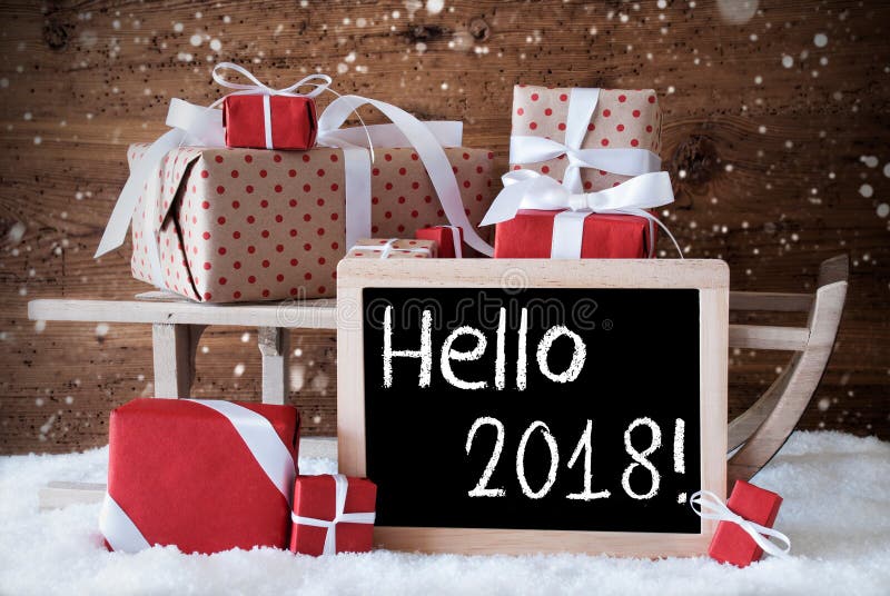 Сани с подарками, снег, снежинки, текст здравствуйте! 2018 стоковая фотография rf Сани с подарками, снег, снежинки, текст здравствуйте! 2018 стоковая фотография rf