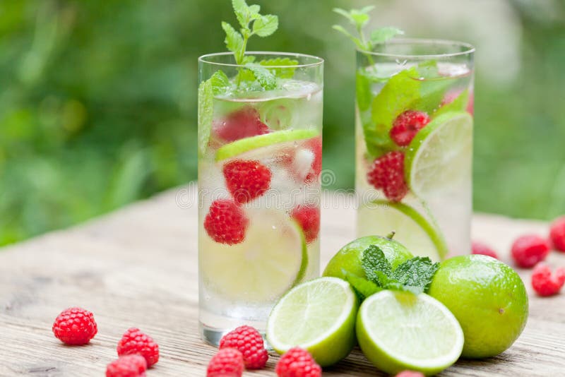 Fresh cold drink water ice cubes peppermint lime raspberry outdoor summer. Fresh cold drink water ice cubes peppermint lime raspberry outdoor summer