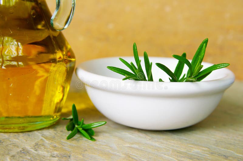 Bowl of fresh rosemary, and olive oil. Bowl of fresh rosemary, and olive oil