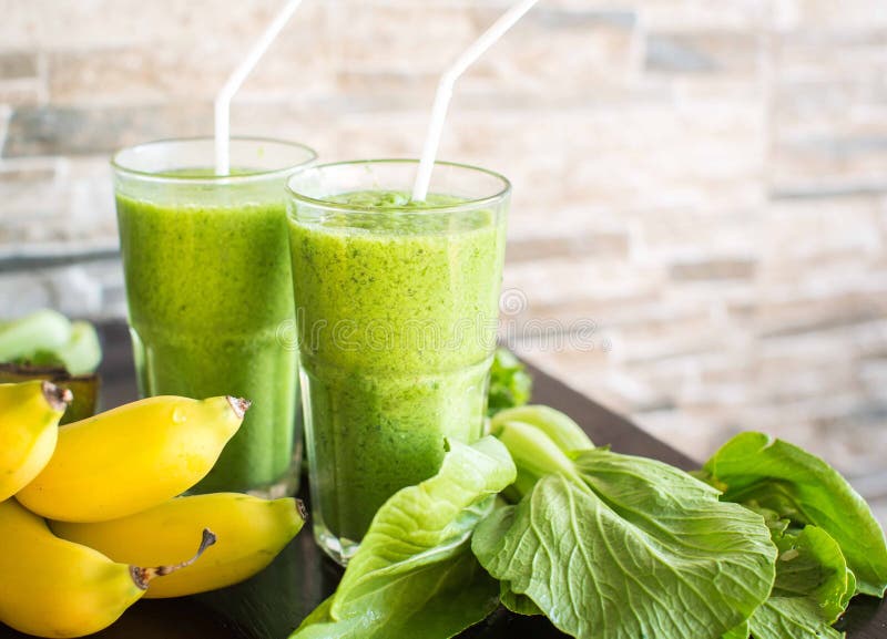 Fresh green smoothie with banana and spinach . Fresh green smoothie with banana and spinach .