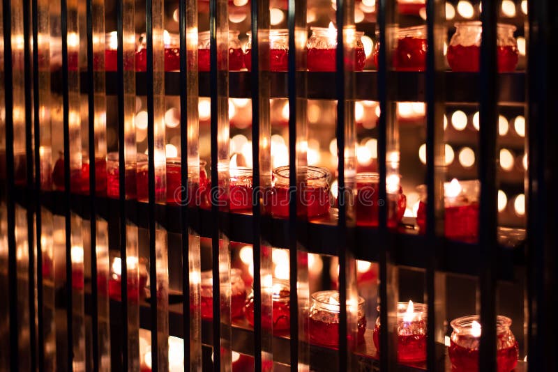 Large number of Candles lightened in a temple . Large number of Candles lightened in a temple