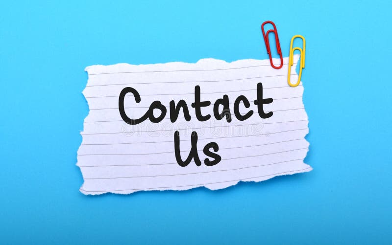 Contact us hand written on paper with blue background. Contact us hand written on paper with blue background.