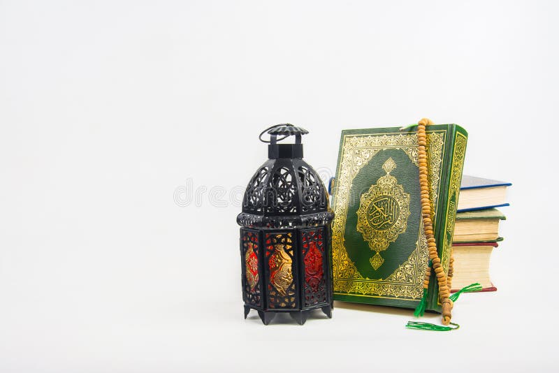 Koran holy book of Muslims with lightened Lantern style Arab or Morocco . Koran holy book of Muslims with lightened Lantern style Arab or Morocco .