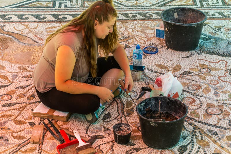BITOLA, NORTH MACEDONIA - AUGUST 7, 2019: Archaeologist working at Heraclea Lyncestis ancient ruins near Bitola, North Macedonia. BITOLA, NORTH MACEDONIA - AUGUST 7, 2019: Archaeologist working at Heraclea Lyncestis ancient ruins near Bitola, North Macedonia