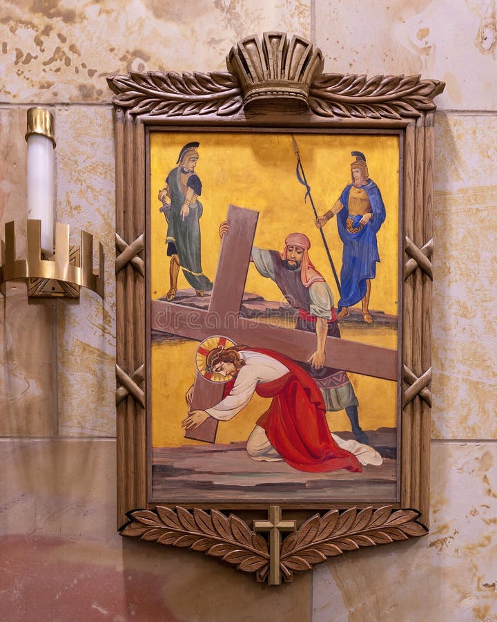 Pictured is seventh of the Fourteen Stations of the Cross located on the walls of the inside of Christ the King Catholic Church in Dallas, Texas.  In the seventh station Jesus falls for the second time.  The Fourteen Stations of the Cross were designed and executed by Leo Cartwright of Carmel, California.  Christ the King Church opened in a wooden building in 1941 and the current new building was completed in 1955. Pictured is seventh of the Fourteen Stations of the Cross located on the walls of the inside of Christ the King Catholic Church in Dallas, Texas.  In the seventh station Jesus falls for the second time.  The Fourteen Stations of the Cross were designed and executed by Leo Cartwright of Carmel, California.  Christ the King Church opened in a wooden building in 1941 and the current new building was completed in 1955.
