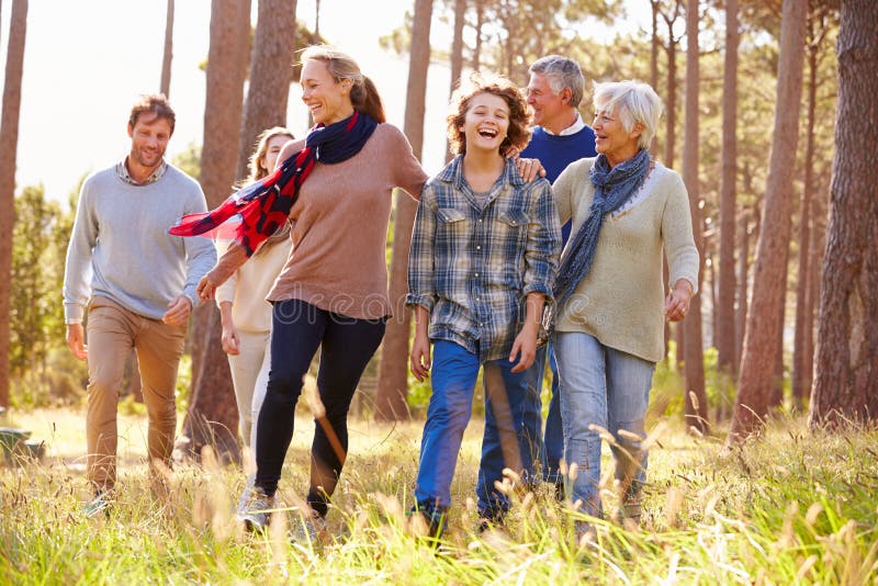 Multi-generation family with teens walking in countryside. Multi-generation family with teens walking in countryside