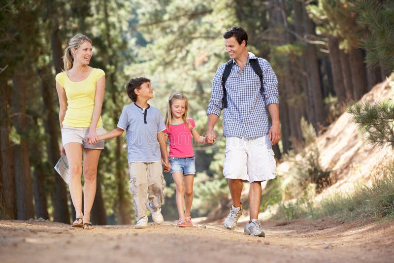 Family enjoying a walk in the countryside laughing away. Family enjoying a walk in the countryside laughing away