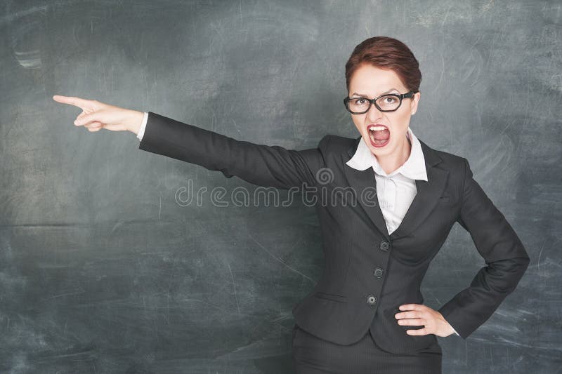 Angry screaming teacher in glasses pointing out. Angry screaming teacher in glasses pointing out