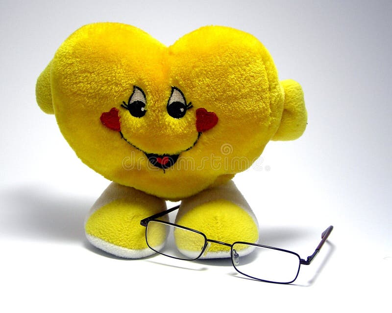 Glasses on very nice yellow heart. Glasses on very nice yellow heart