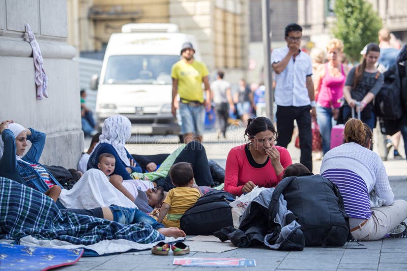 Refugees and migrants, most of them from Syria, are gathered at Keleti train station, Hungary, Sunday 30 august 2015. Thousands of syrian refugees are entering Hungary from Serbia, on their route to Germany. Refugees and migrants, most of them from Syria, are gathered at Keleti train station, Hungary, Sunday 30 august 2015. Thousands of syrian refugees are entering Hungary from Serbia, on their route to Germany.