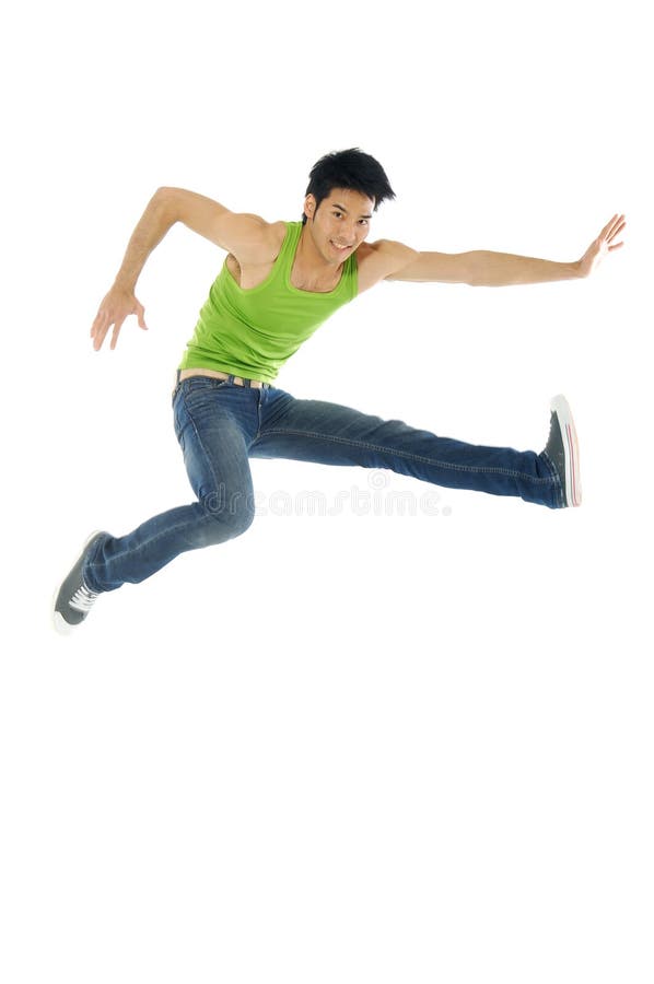 1 Asian man jumping up in the air. 1 Asian man jumping up in the air