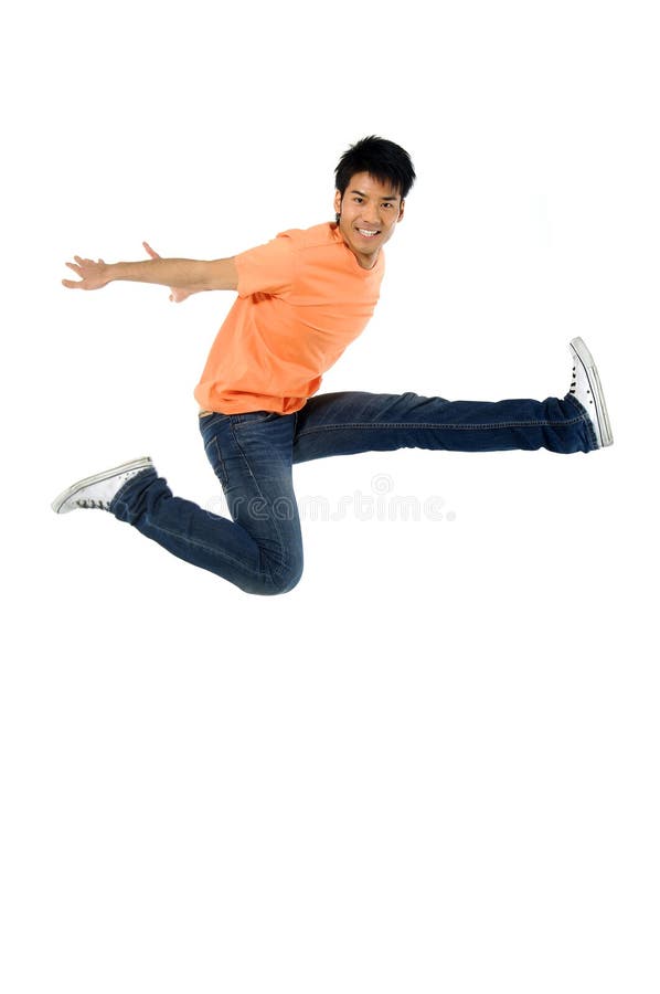 1 Asian man jumping up in the air. 1 Asian man jumping up in the air