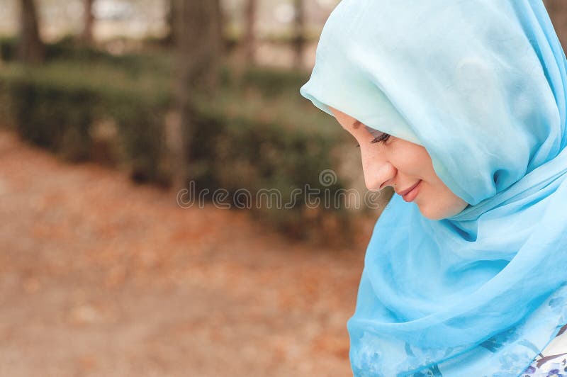 Modest girl in a blue kerchief. Muslim girl. Lifestyle. Modest girl in a blue kerchief. Muslim girl. Lifestyle