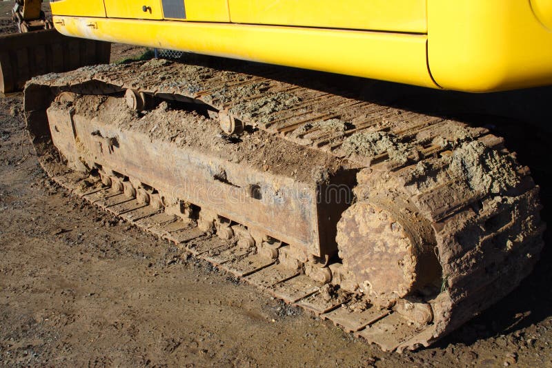Dirty bulldozer track on dirt. Dirty bulldozer track on dirt