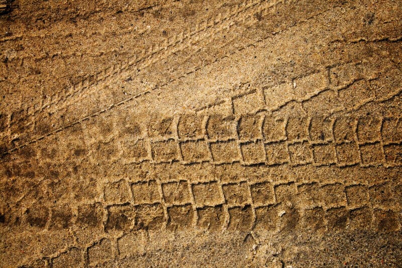 The trace of a tyre in the sand. The trace of a tyre in the sand.