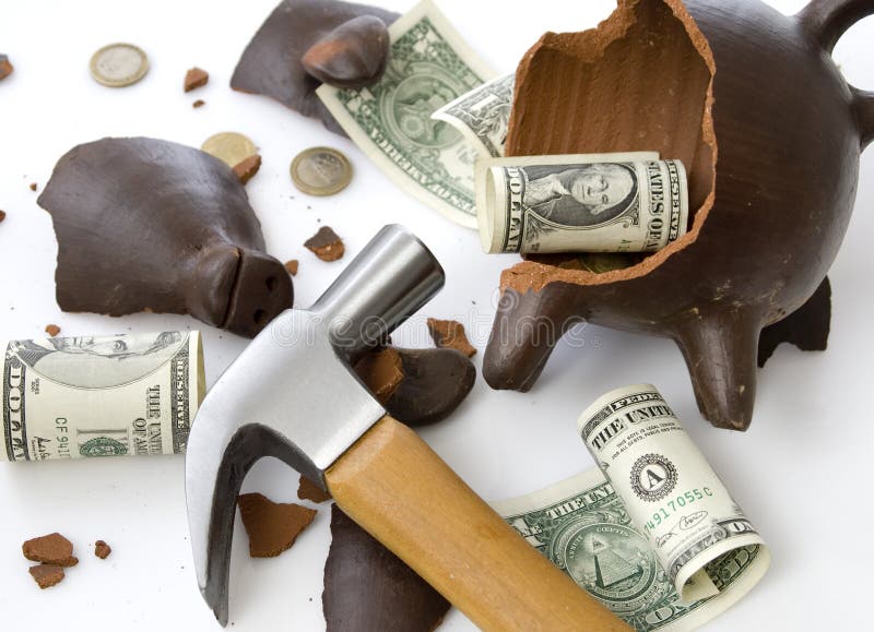 A broken and empty clay piggy money box with money and hammer over white background. A broken and empty clay piggy money box with money and hammer over white background