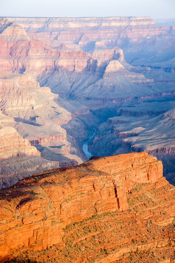 Grand Canyon skyline scenery with Colorado river at Hopi Point in vertical view shown morning sunlight and shadow on rocky cliff. Grand Canyon skyline scenery with Colorado river at Hopi Point in vertical view shown morning sunlight and shadow on rocky cliff.