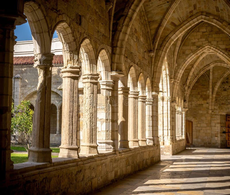 Santander Cathedral, detail of a hallway, columns and arches of the cloister. Santander Cathedral, detail of a hallway, columns and arches of the cloister
