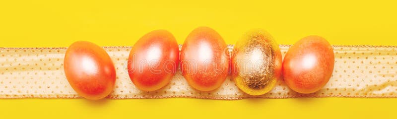 Modern trendy easter concept with five colored pink and golden eggs over bright yellow background, banner. Modern trendy easter concept with five colored pink and golden eggs over bright yellow background, banner