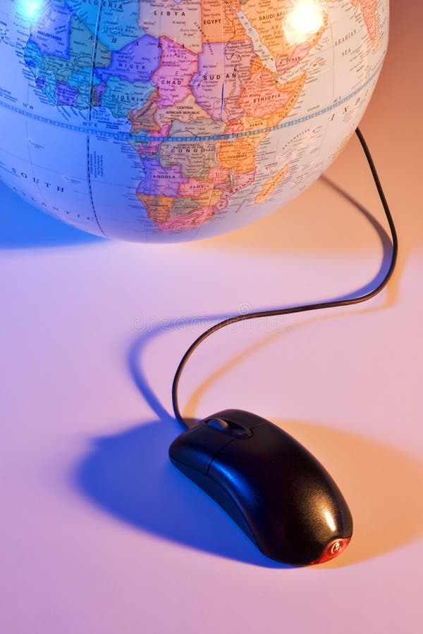 Computer mouse connected to an earth globe. Computer mouse connected to an earth globe