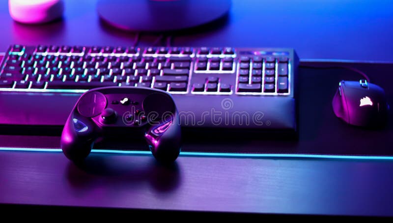 Gaming setup with rgb peripherals illuminated by led lights. Gaming setup with rgb peripherals illuminated by led lights