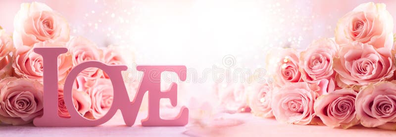 Festive still life with pink roses and word `Love`. Flower composition with roses. Soft focus. Festive still life with pink roses and word `Love`. Flower composition with roses. Soft focus