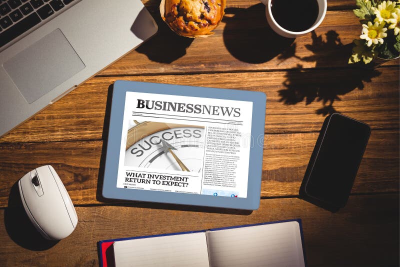 View of a desk against business newspaper. View of a desk against business newspaper