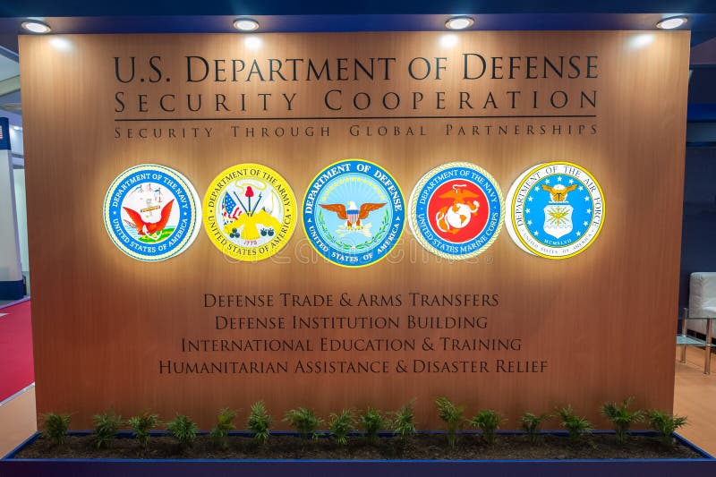 Farnborough, UK - July 20, 2018: Office partition wall for the US Department of Defense with combined military emblems at a trade event in Farnborough, UK. Farnborough, UK - July 20, 2018: Office partition wall for the US Department of Defense with combined military emblems at a trade event in Farnborough, UK