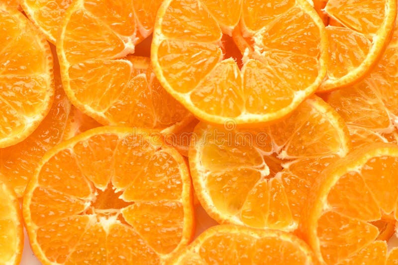 juicy and appetizing tangerines cut into circles as a food background 2. juicy and appetizing tangerines cut into circles as a food background 2