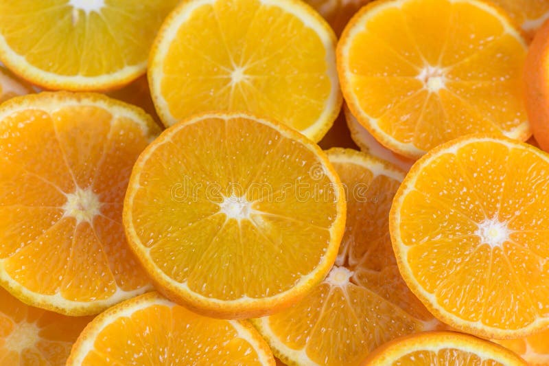 juicy tangerines cut into circles as a background 1. juicy tangerines cut into circles as a background 1
