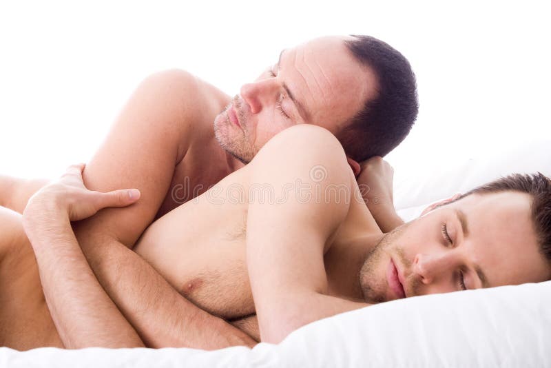 Happy couple in a white bed taking care of his boyfriend. Happy couple in a white bed taking care of his boyfriend
