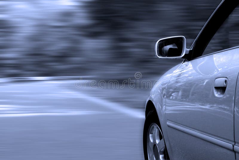 Car driving fast along a countryroad, blurred background, all tuned in blue. Car driving fast along a countryroad, blurred background, all tuned in blue