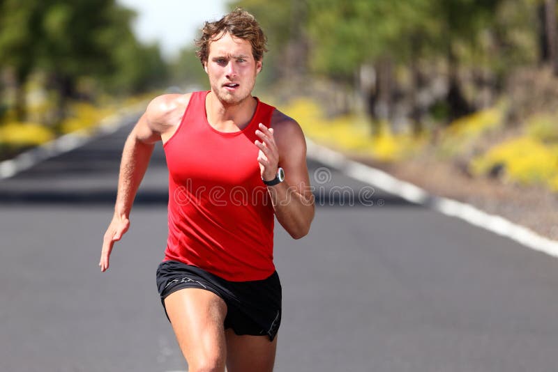 Running sport man. Fit muscular young male runner sprinting at great speed outdoors on road. Running sport man. Fit muscular young male runner sprinting at great speed outdoors on road.