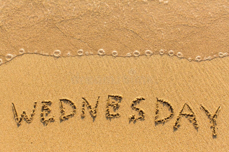 Wednesday - hand-written on the sand in line of the sea surf. Wednesday - hand-written on the sand in line of the sea surf.