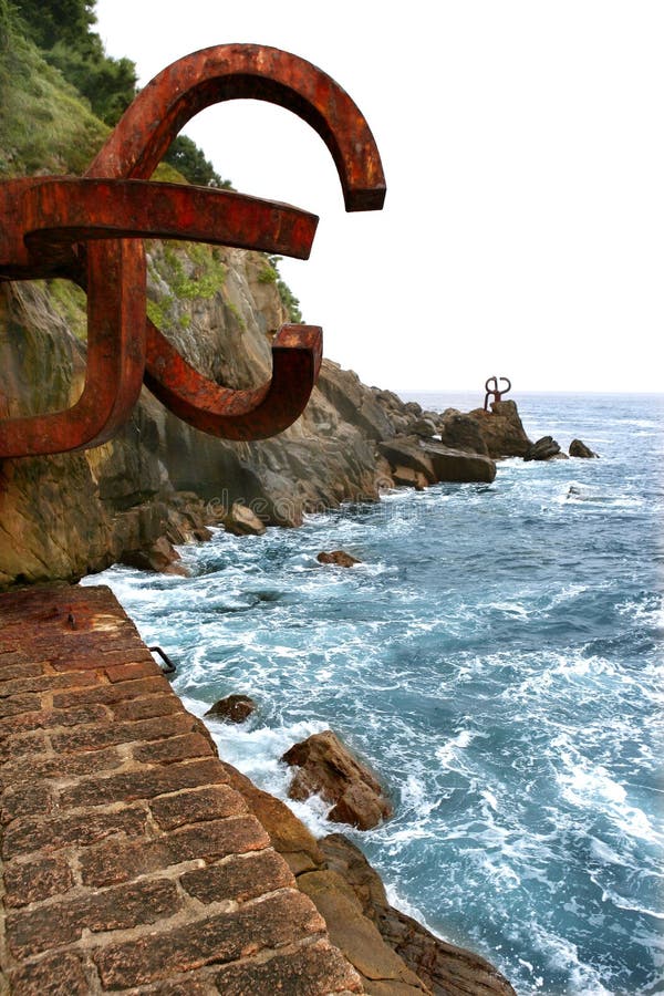 Chillida rusty steel sculpture in San Sebastian sea: Peine de los Vientos. Chillida rusty steel sculpture in San Sebastian sea: Peine de los Vientos