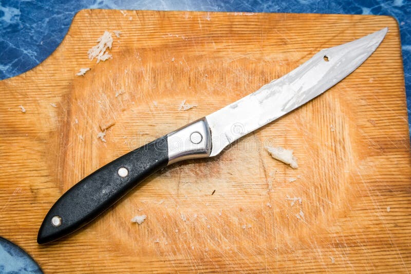 Стальная кухня knive на взгляд сверху деревянной доски стоковое изображение rf Стальная кухня knive на взгляд сверху деревянной доски стоковое изображение rf
