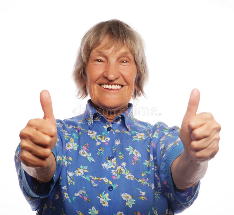 Old happy woman showing ok sign on a white background. Old happy woman showing ok sign on a white background