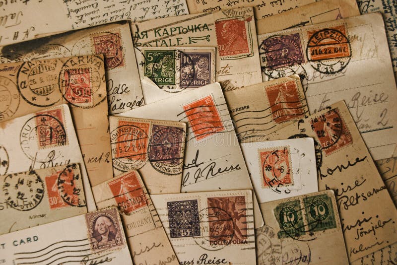 Old stamps on vintage travel postcards with handwritten greetings from 1920-1930. Old stamps on vintage travel postcards with handwritten greetings from 1920-1930