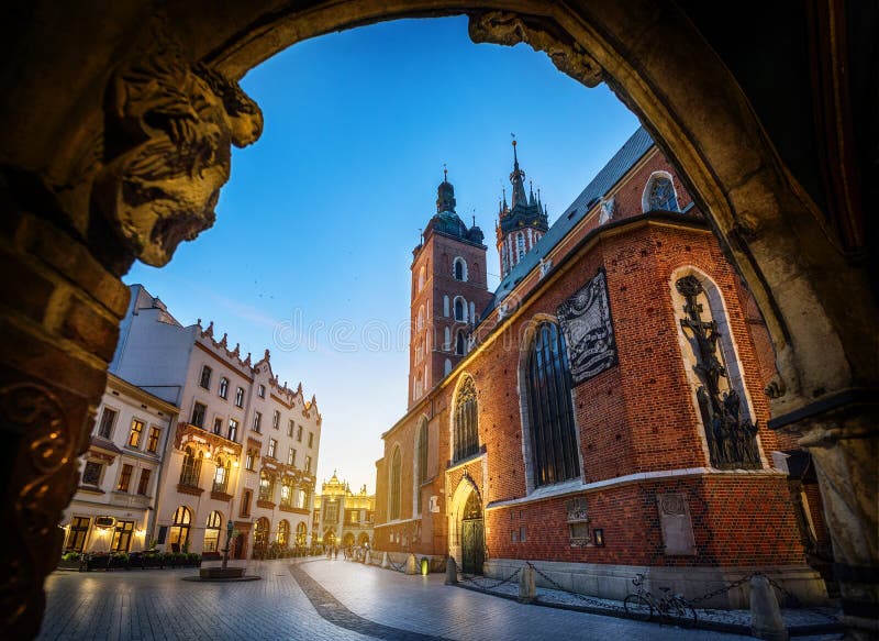 Old city center view with St. Mary`s Basilica in Krakow, Poland. Night view, long exposure. Old city center view with St. Mary`s Basilica in Krakow, Poland. Night view, long exposure.